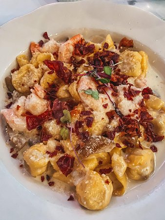 Catullo’s Italian signature dishes Pear & Fig Fiocchi, Cacio e Pepe, Chicken Parmigiana, Shrimp Scampi, Fritto Misto